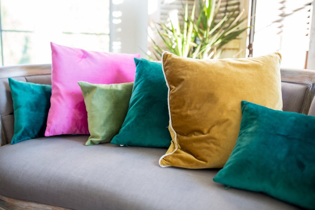 Grey Sofa with assorted jewel tone pillows